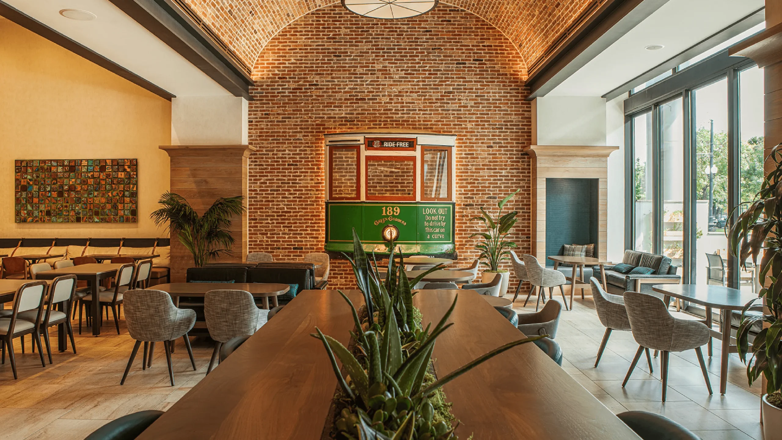 a dining area with tables, chairs, and a trolley